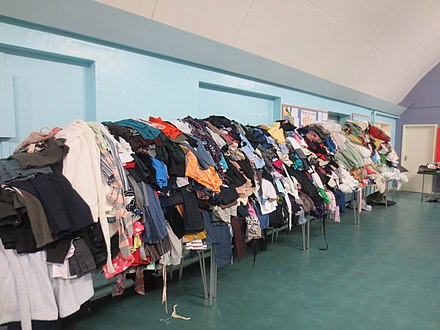 Clothes piled high at the 5th Manchester Boys' Brigade Jumble Sale