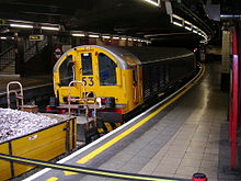 L53 locomotive at one end of a track ballast train waiting at Baker Street station, July 2006. Battery locomotive at baker st.jpg