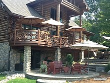 Mountain Laurel Railings are curved to match a circular deck on a log home. Best-deck-railing.jpg
