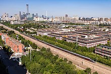 High speed train passing the Beijing central business district CR400BF-GZ-5203 and 5143 at Xidian (20210907094248).jpg