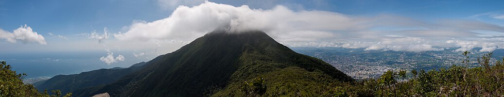 Panoramic view of La Guaira city and Caribbean sea (left), and Caracas (right). At the center is Oriental peak at El Avila National Park.