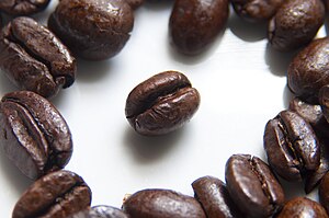 English: Roasted coffee beans photographed usi...
