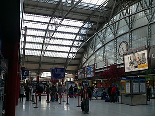 A reverse view of the main concourse of Lime Street station, inside the northern trainshed, displaying the other Joyce of Whitchurch clock on the inside face