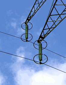 Corona rings on insulator strings on a 225 kV transmission line in France Corona rings on insulators.png