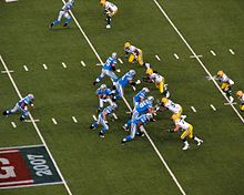The Detroit Lions, seen here during the 2007 Thanksgiving game against their division rival Green Bay Packers, have played on Thanksgiving since 1934. DetroitLionsRunningPlay-2007.jpg