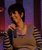 A woman holding a microphone