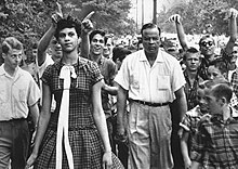 Counts walks to school on her first day, amid jeers from other students. (Photo by Douglas Martin, winner of 1957 World Press Photo of the Year) Dorothy Counts.jpg