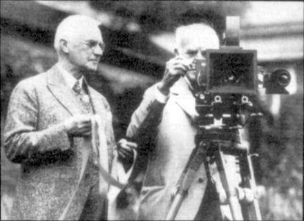 Eastman (L) giving Edison the first roll of movie film, which was 35 mm
