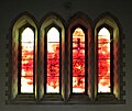 The Millennium Window based on Revelation 22 v5. They need no light of lamp or sun, for the Lord God will be their light, and they will reign for ever and ever. "The sun sets on the city of Swansea but rises in the new Jerusalem"