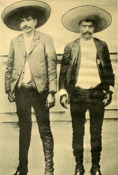 Undated photo of Emiliano Zapata (right) and his older brother Eufemio (left), dressed in the charro fashion of the countryside. Some posthumous artis