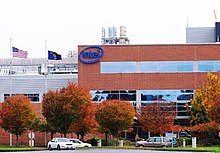 Red brick and metal office and production facility at Intel Corporation's Ronler Acres campus. Building is the main entrance and includes the company's logo on the exterior.