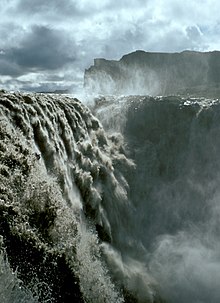 Dettifoss, located in northeast Iceland. It is the second-largest waterfall in Europe in terms of volume discharge, with an average water flow of 200 m /s. Iceland Dettifoss 1972-4.jpg