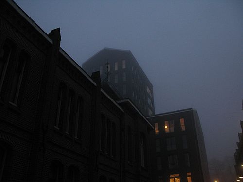 Building with a tower, in fog, seen from Pijkestraat, Nimeguen, The Netherlands