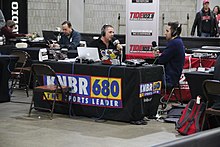 KNBR anchors at the Georgia World Congress Center for the 2018 College Football Playoff National Championship KNBR at the College Football Playoff National Championship Playoff Fan Central, Jan 2018.jpg