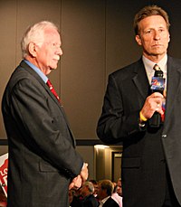 Steve MacDonald, anchor and reporter from 1996 to 2016, prior to a live interview with Alaska Senate candidate Bob Bell at the Dena'ina Center in August 2012. KTUU reporter Steve MacDonald preparing to interview candidate Bob Bell, August 2012.jpg