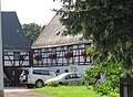 Residential stable house and barn of a three-sided courtyard