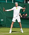 Luke Saville competing in the first round of the 2015 Wimbledon Qualifying Tournament at the Bank of England Sports Grounds in Roehampton, England. The winners of three rounds of competition qualify for the main draw of Wimbledon the following week.