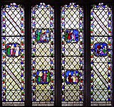 Photo of colourful stained class window showing human figures