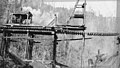 Men with steam engine on elevated tracks, possibly building trestle, Bloedel-Donovan Lumber Mills, ca 1922-1923 (INDOCC 1126).jpg