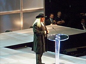 Hayes speaking at a WWE Hall of Fame ceremony in 2009 Micheal Hayes.jpg