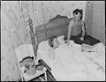 Mr. and Mrs. Andrew Broughton with their twelve hour old baby. They and their other son live in a four room house for... - NARA - 541152.jpg