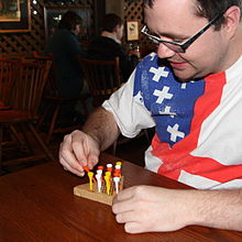 A Cracker Barrel guest playing peg solitaire PegGame.jpg