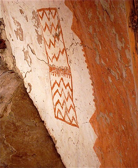 Preserved through the centuries, a rare pictograph and red paint decorate an Ancestral Puebloan dwelling.