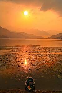 Golden hour over Phewa Lake, Pokhara. © Lurey Rohit