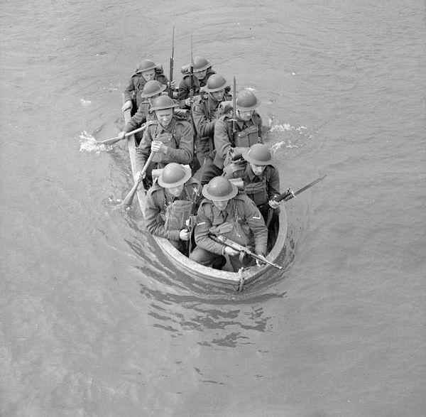 An infantry section from the Royal Sussex Regiment stage a river crossing in a collapsible boat, Chichester, 25 March 1941.