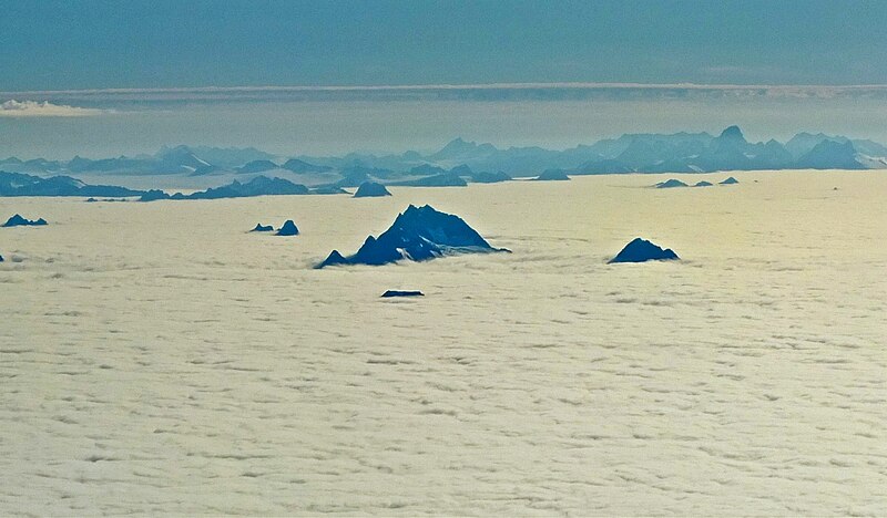 File:The Snow Towers above clouds.jpg