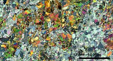 In optical mineralogy, thin sections are used to study rocks. The method is based on the distinct refractive indices of different minerals. Thin section scan crossed polarizers Siilinjarvi R636-105.90.jpg
