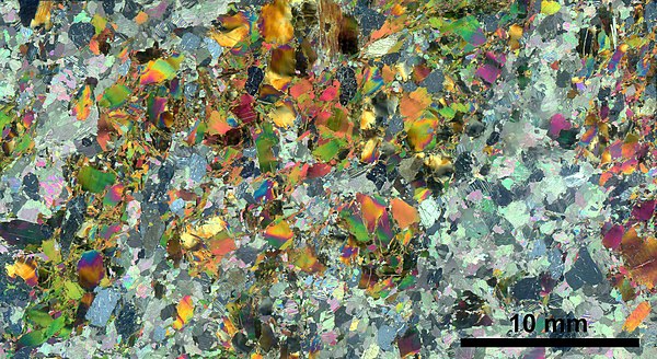 In optical mineralogy, thin sections are used to study rocks. The method is based on the distinct refractive indices of different minerals.