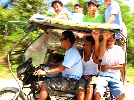 A tricycle with many passengers in Tagkawayan, Quezon