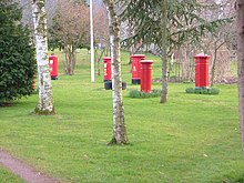 Collection of British pillar boxes at the Inkpen Post Box Museum, near Taunton, Somerset - since moved to Oakham Treasures, Gordano, Bristol, UK Uk pillarbox collection.jpg