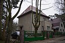 Ludomer residential building with street-side fence