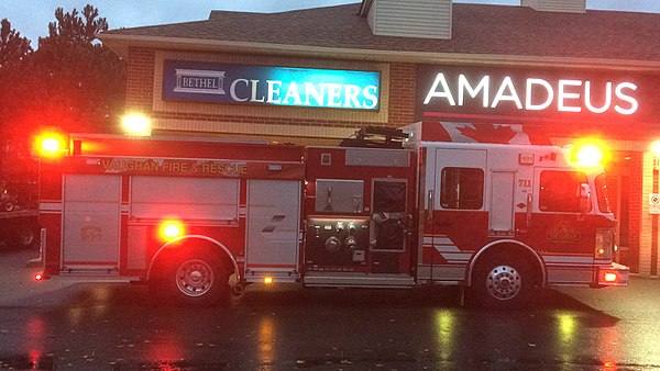 A fire truck with red emergency lights