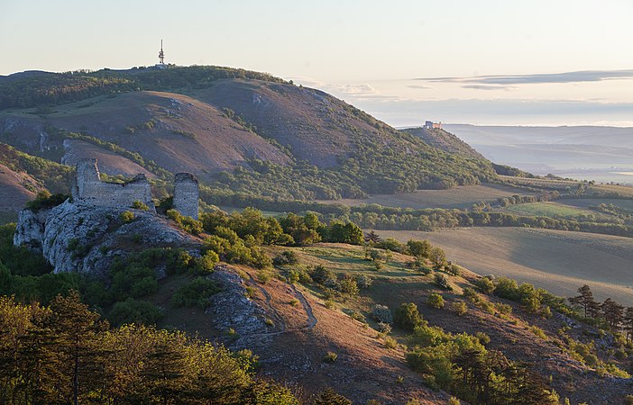 View from Stolová hora to the north with hill Děvín (in the background) and castle Sirotčí hrádek (in the foreground) in Pálava Protected Landscape Area