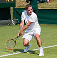 Vincent Millot competing in the first round of the 2015 Wimbledon Qualifying Tournament at the Bank of England Sports Grounds in Roehampton, England. The winners of three rounds of competition qualify for the main draw of Wimbledon the following week.