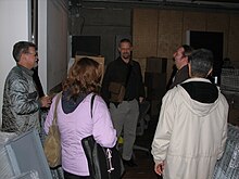 (l to r): Unidentified, Cheryl Steffan (back of head), Cary Bass, Brion Vibber, Kul Wadhwa (back of head)