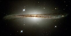 Galaktyka Spiralna: Galaktyka o kształcie spłaszczonego dysku, w którym występują spiralne ramiona