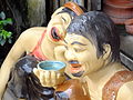 Image 11Vietnamese statues depicting the traditional practice of teeth blackening (nhuộm răng đen) (from Culture of Vietnam)