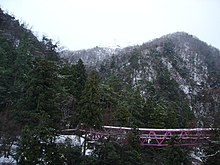 Hotel is located in the Kakusenkei valley surrounded by mountains. Yamanakabridge.JPG