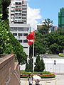 Hong Kong and Chinese flags in front of Kowloon Park