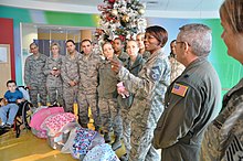 Airmen from the 514th Air Mobility Wing deliver pajamas and sweat pants 514th Air Mobility Wing airmen gift delivery to Children's Specialized Hospital.JPG