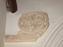 8th-century stone roundel in the south aisle of the church