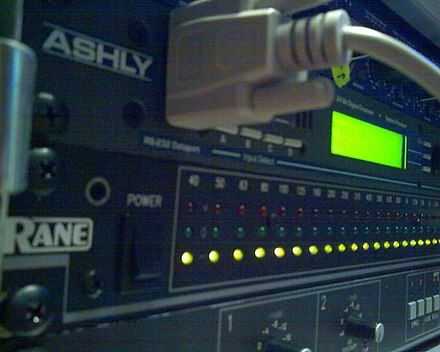 A Rane RA 27 hardware Real Time Analyzer underneath an Ashly Protea II 4.24C speaker processor (with RS-232 connection)