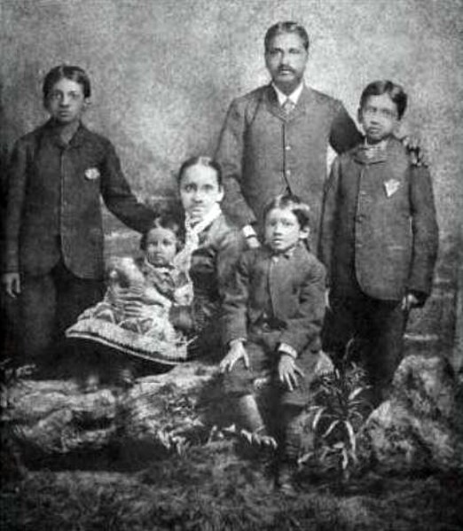Aurobindo (seated centre next to his mother) and his family. In England, ca. 1879
