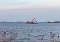 * Nomination Dredging activities on the Langwarder Wheels. Dredging activities in the middle of the lake. --Famberhorst 16:01, 25 March 2018 (UTC) * Promotion Good composition and good quality -- Spurzem 19:09, 25 March 2018 (UTC)