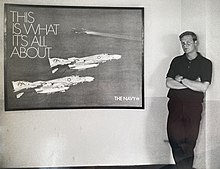 Curtsinger in the 1960s next to a U.S. Navy recruiting poster. He is credited for the photograph used in this poster. Bill Curtsinger Navy recruit poster.jpg