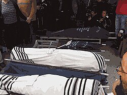 Bodies wrapped in tallit at funeral in Givat Shaul Bodies wrapped in tallit at funeral in Givat Shaul (Fogel family).jpg